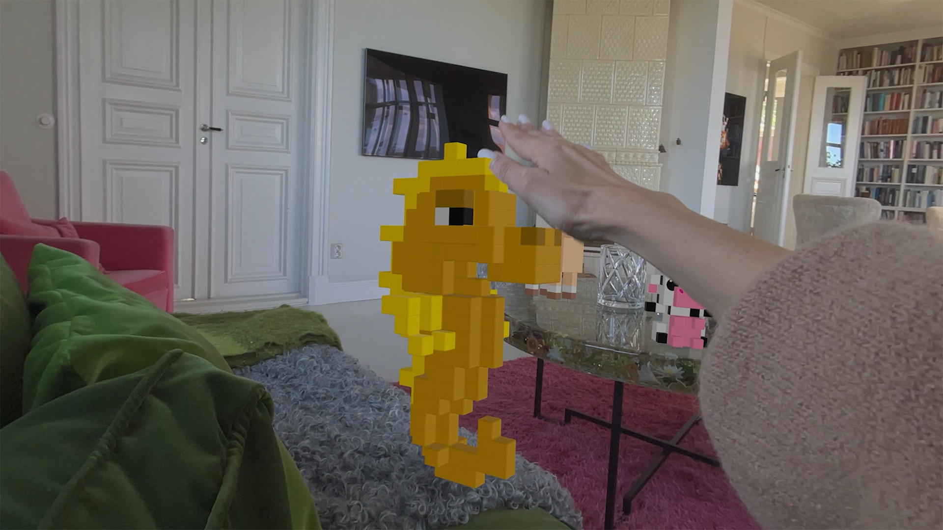 Puzzle Sculpt MR screenshot showing a person petting a physical pet in-game